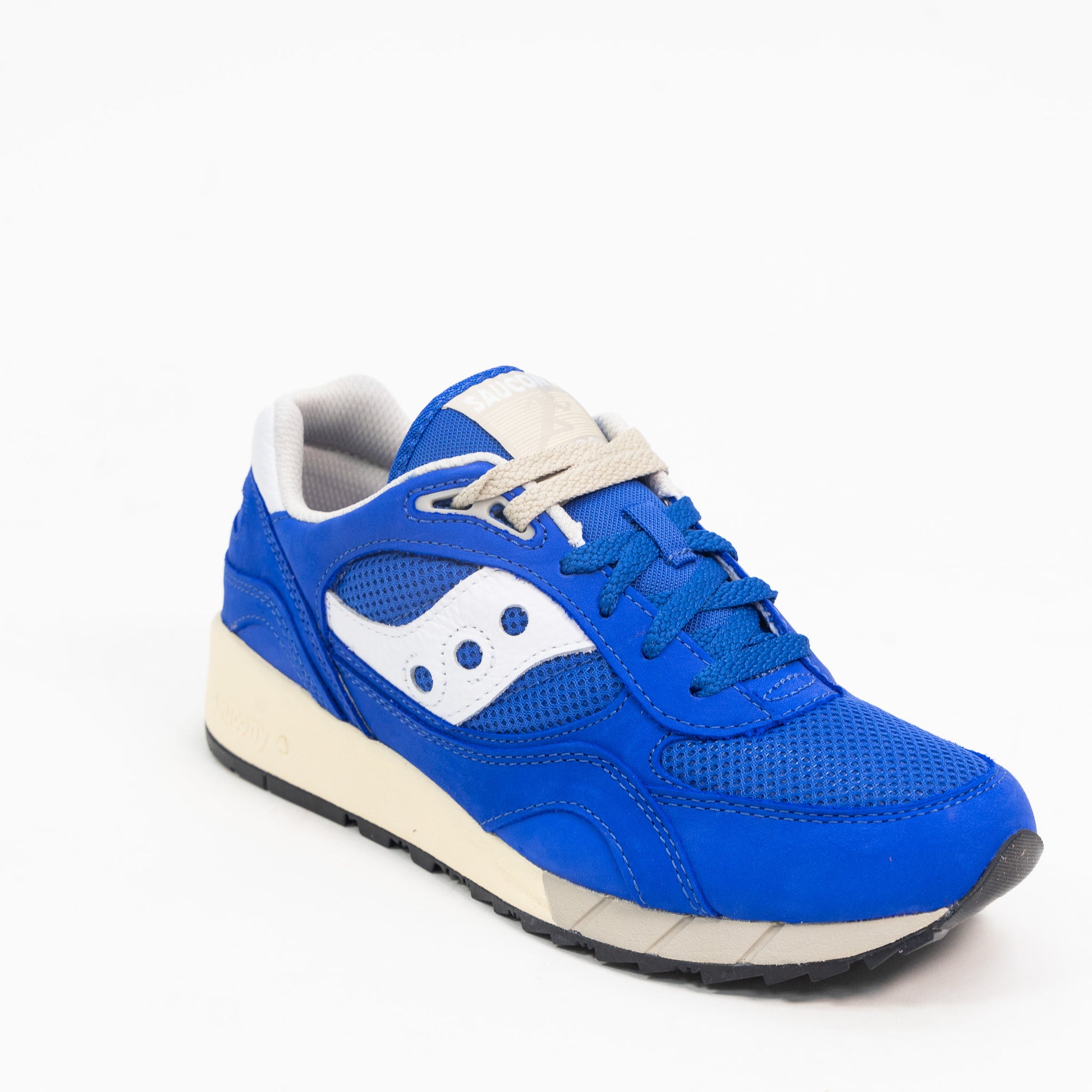 blue saucony shadow 6000 men's comfort shoe with white detail and an off white sole