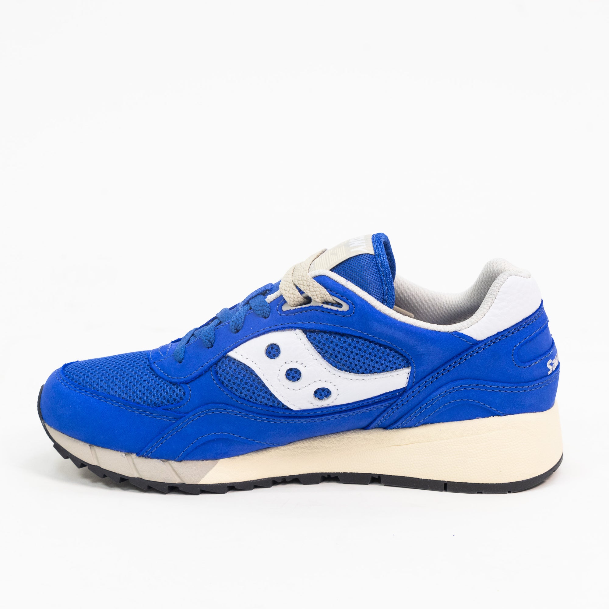 blue saucony shadow 6000 men's comfort shoe with white detail and an off white sole