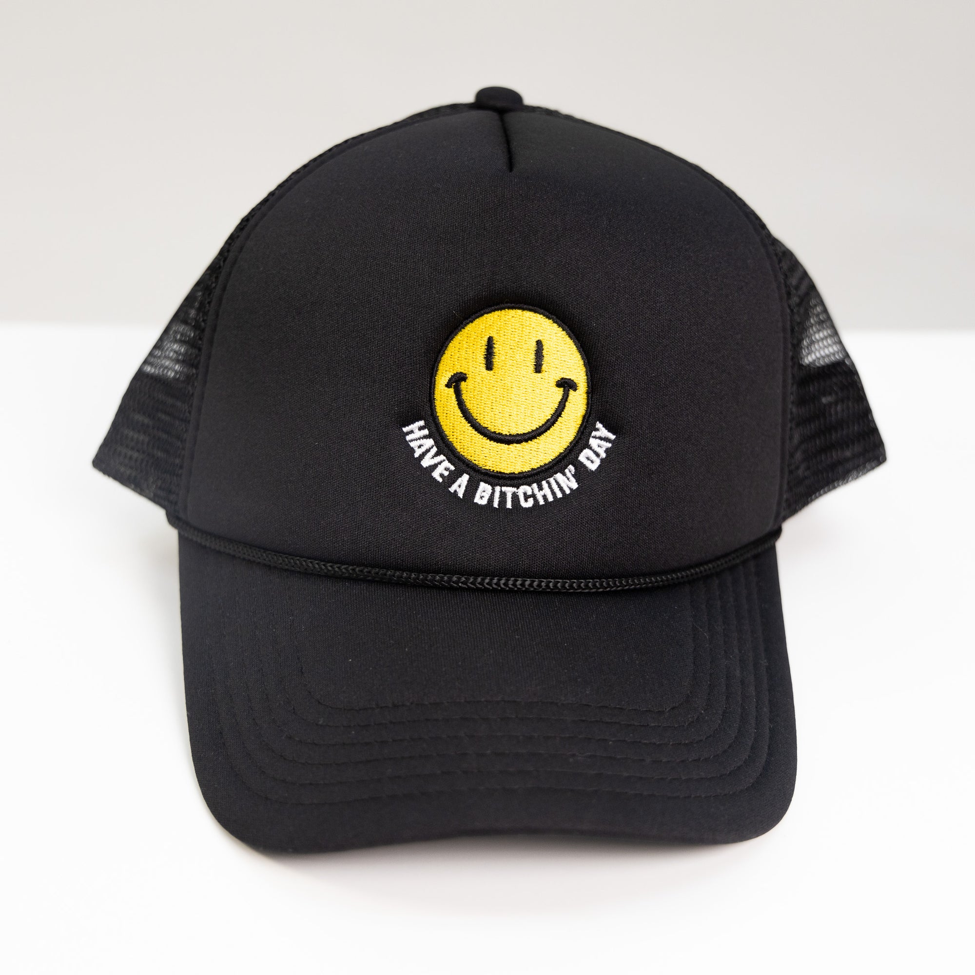 black embroidered have a bitchin' day trucker hat