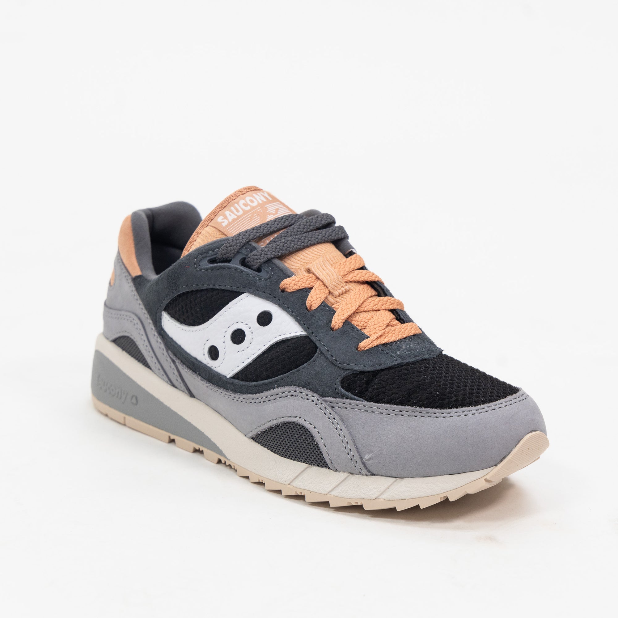 black and grey saucony shadow 6000 women's comfort shoe with pink orange detail and an off white and grey sole