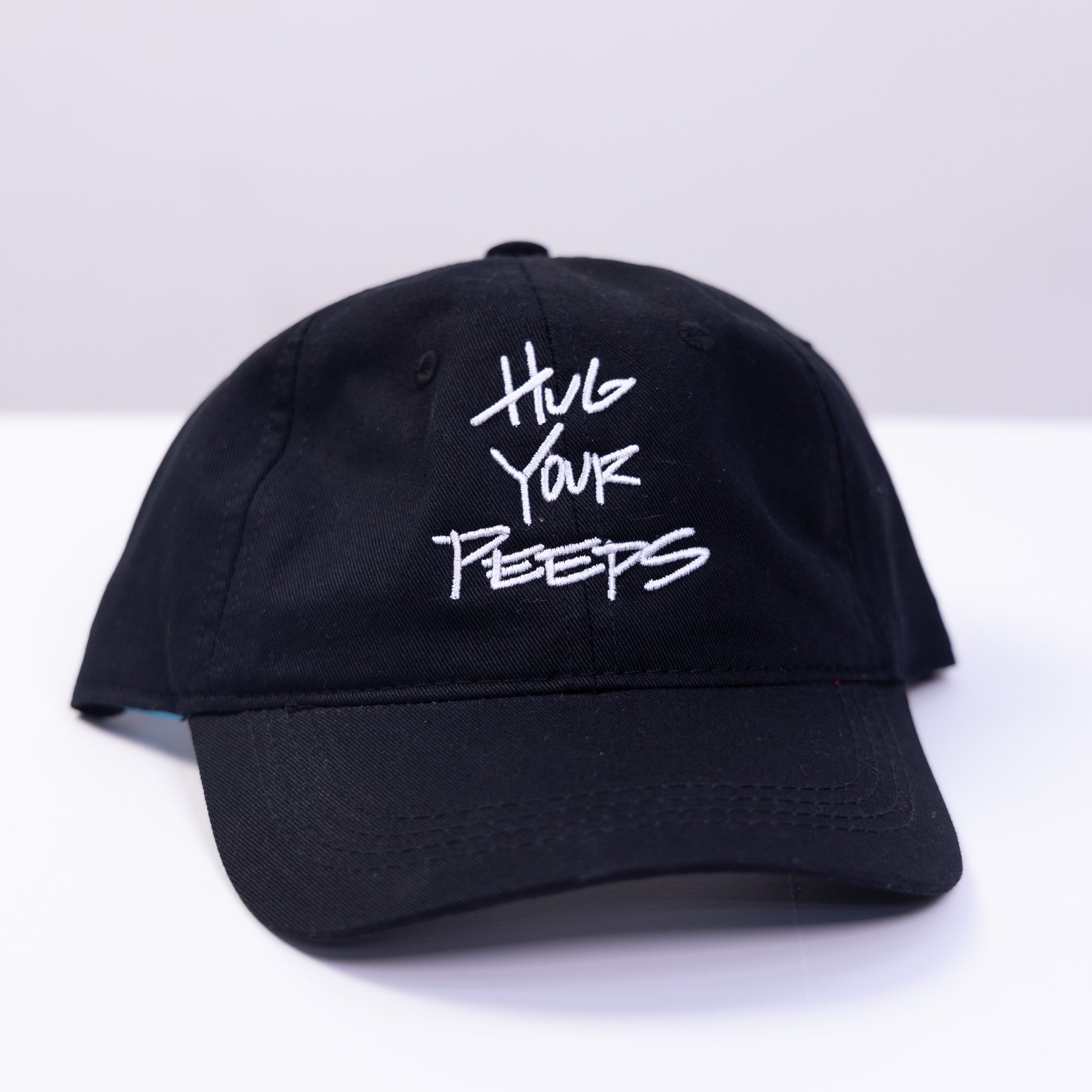 black hat with the slogan hug your peeps