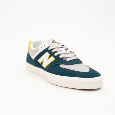 green and white men's new balance shoe with white sole and yellow detail available in standard and wide