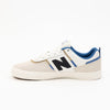 white men's new balance shoe with blue and brown detail