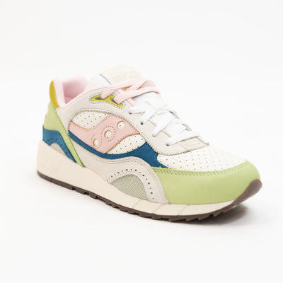 green and white saucony shadow 6000 women's comfort shoe with blue pink and yellow detail and an off white sole