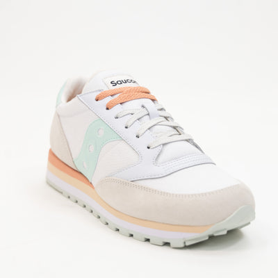 grey and white saucony triple women's stacked sole with mint green and orange details comfort shoe