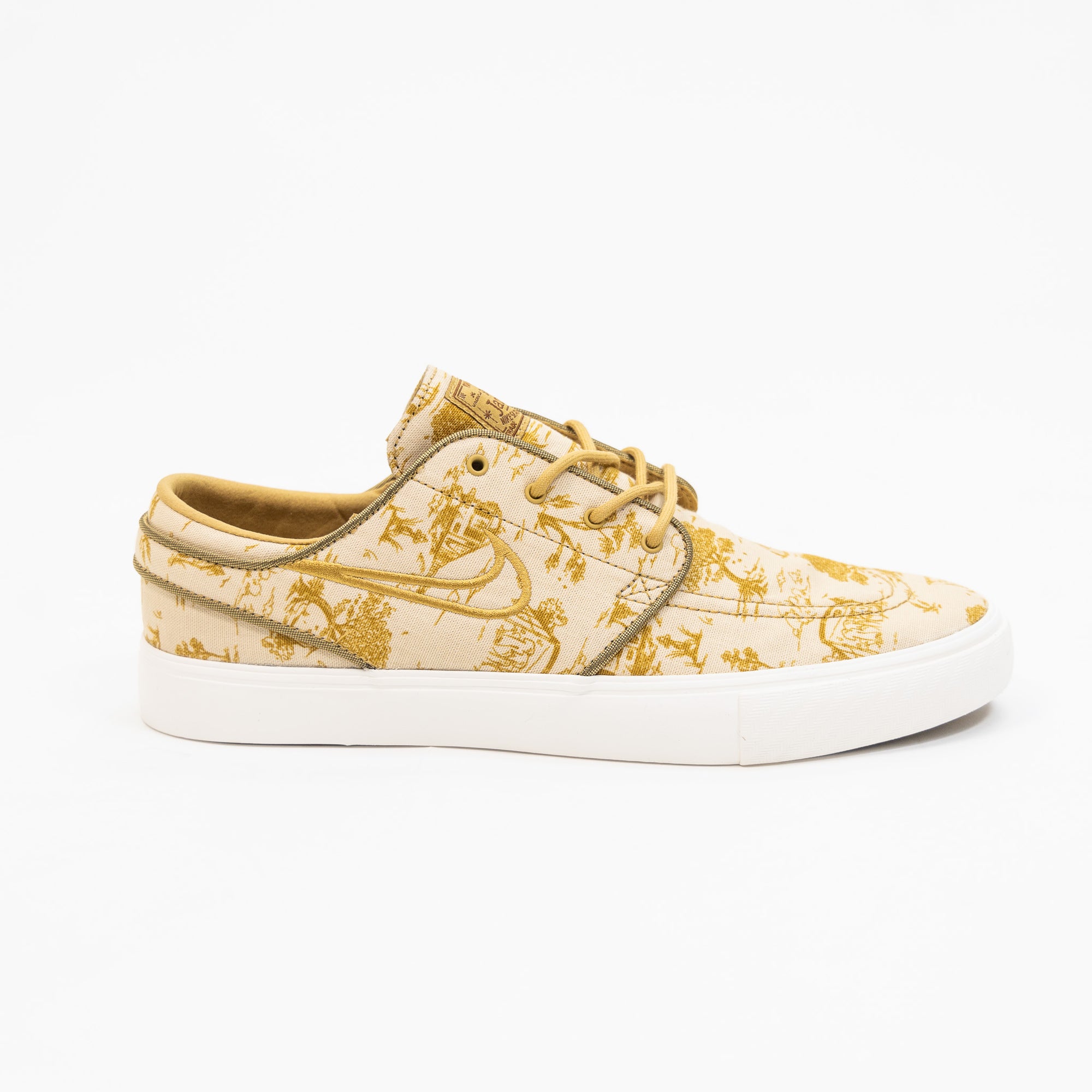 tan and gold city of style nike sb janoski low top men's skate shoe with all over print and white sole