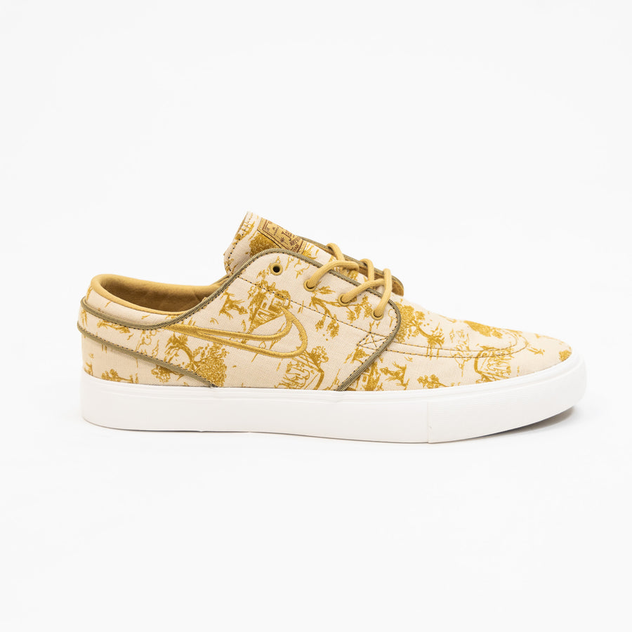 tan and gold city of style nike sb janoski low top men's skate shoe with all over print and white sole