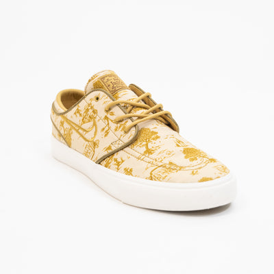 tan and gold city of style nike sb janoski low top men's skate shoe with all over print and white sole