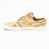 tan and gold city of style nike sb janoski low top men's skate shoe with all over print and white sole