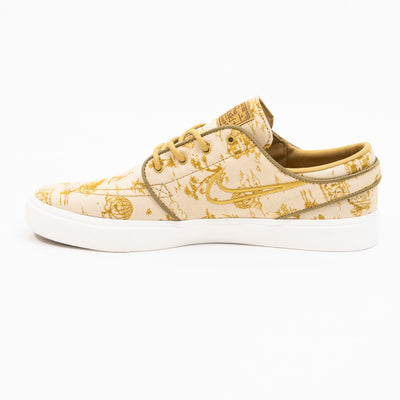 tan and gold city of style nike sb janoski low top men's skate shoe with all over print and white sole