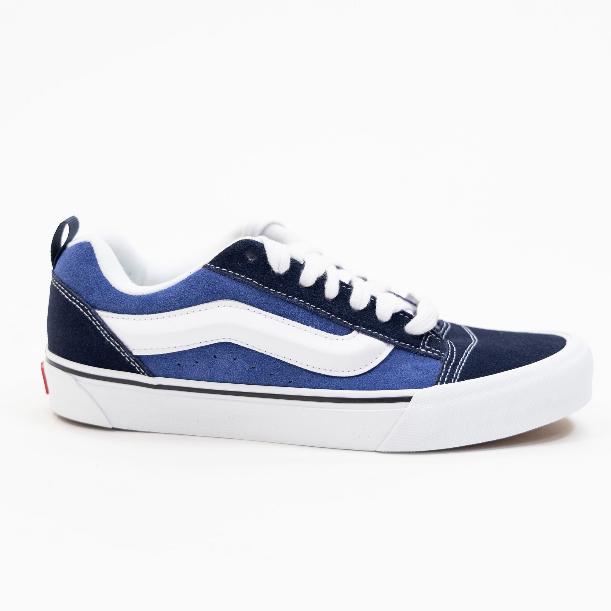 navy blue men's and women's knu skool shoe with white sidestripe and white sole