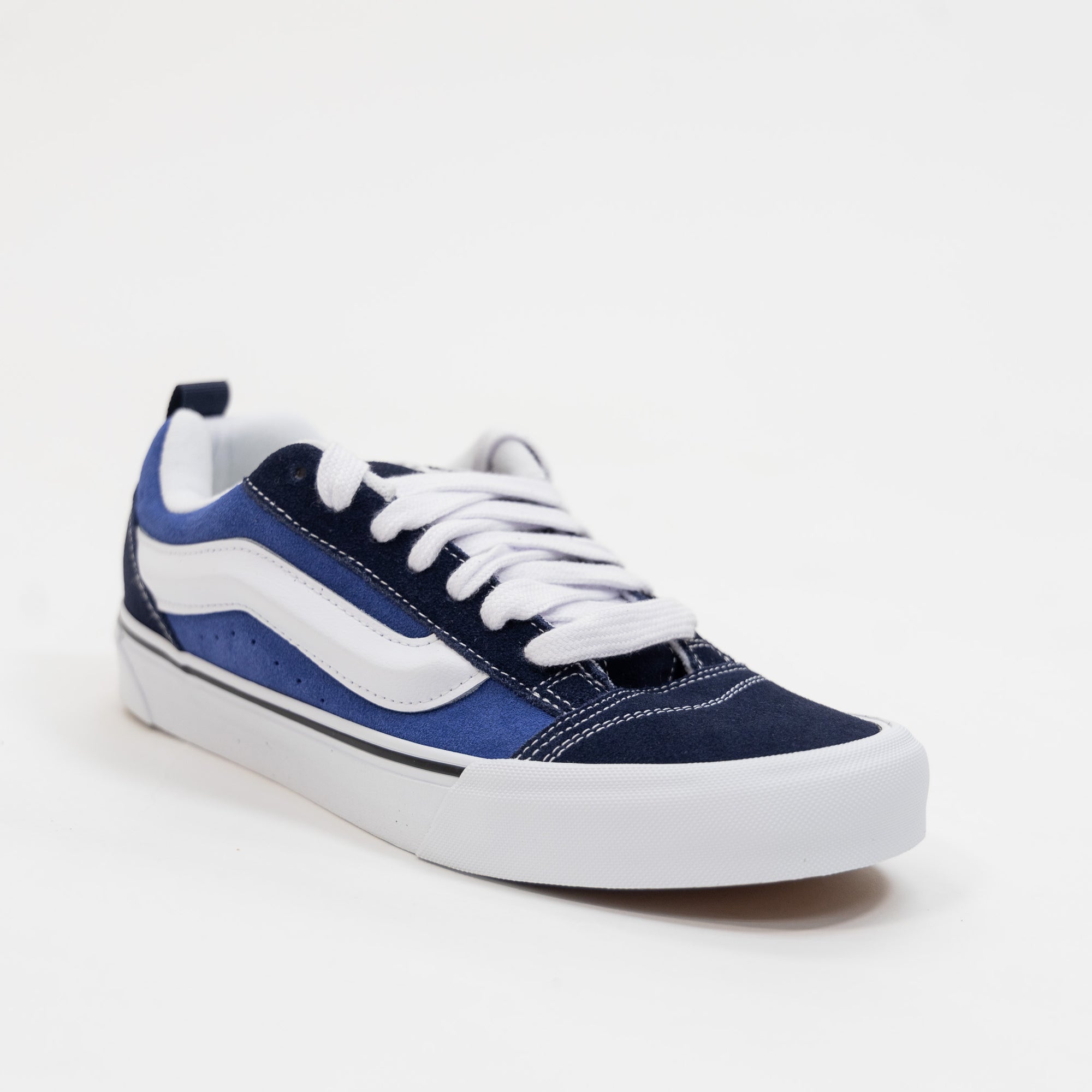 navy blue men's and women's knu skool shoe with white sidestripe and white sole
