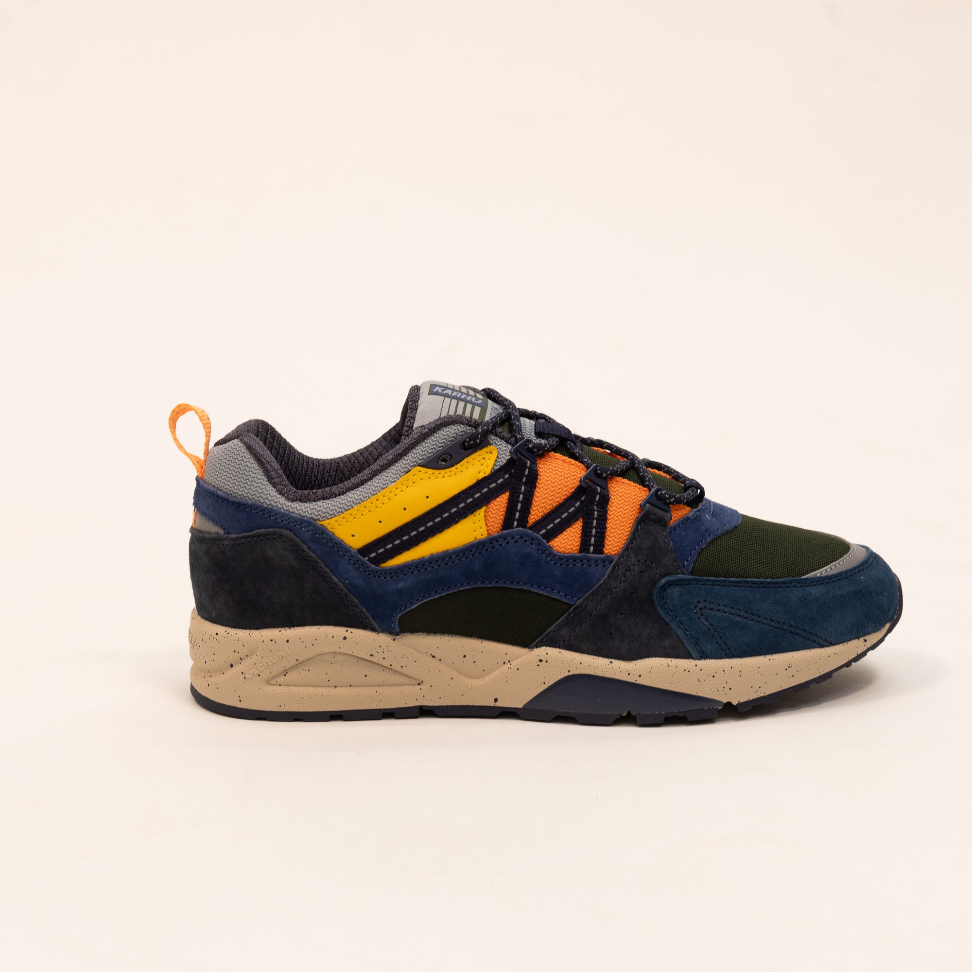 blue karhu men's shoe with green orange and yellow details