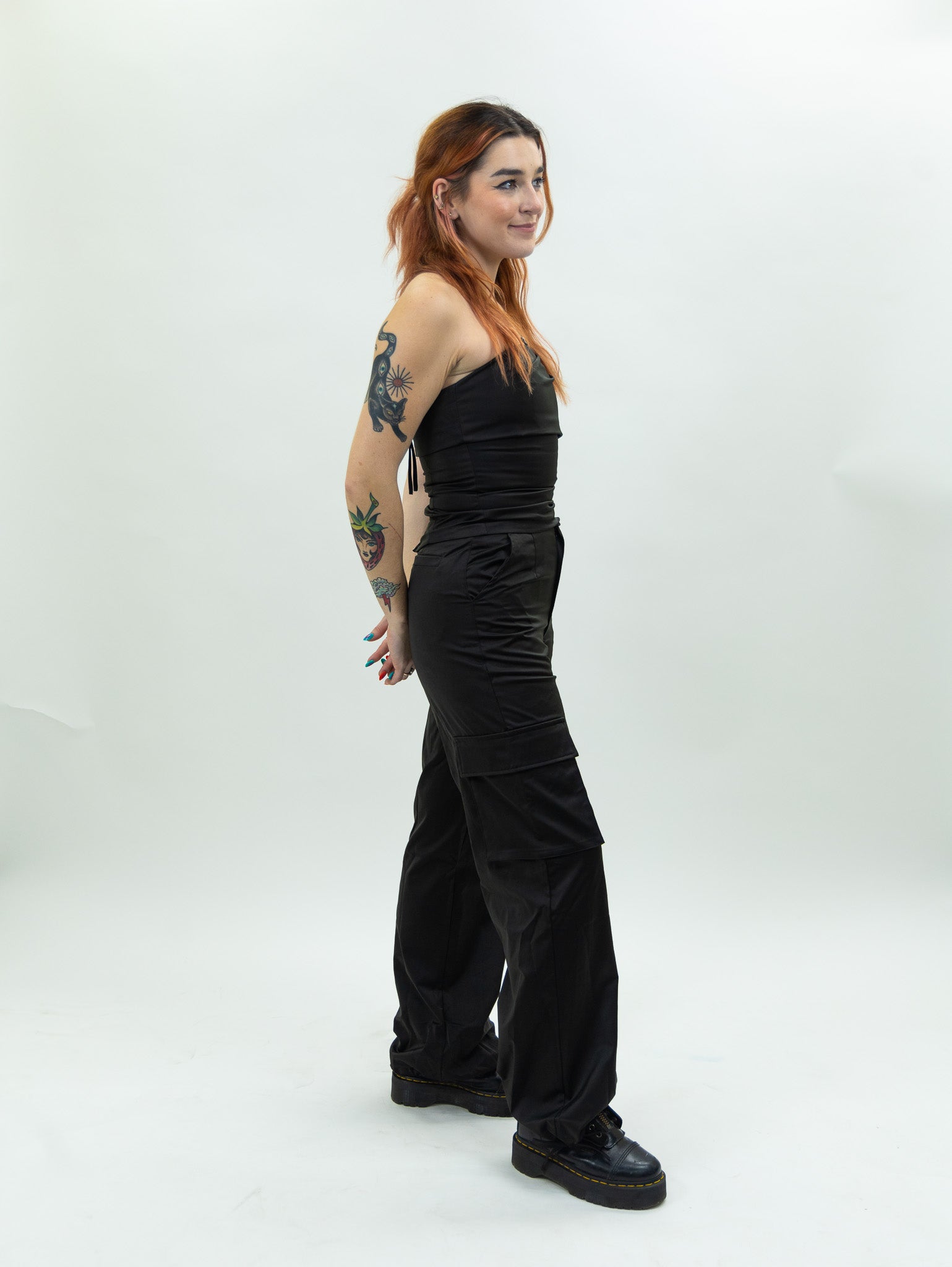 black nia Mid-rise thick satin parachute pants featuring patch pockets and adjustable ties at the ankles