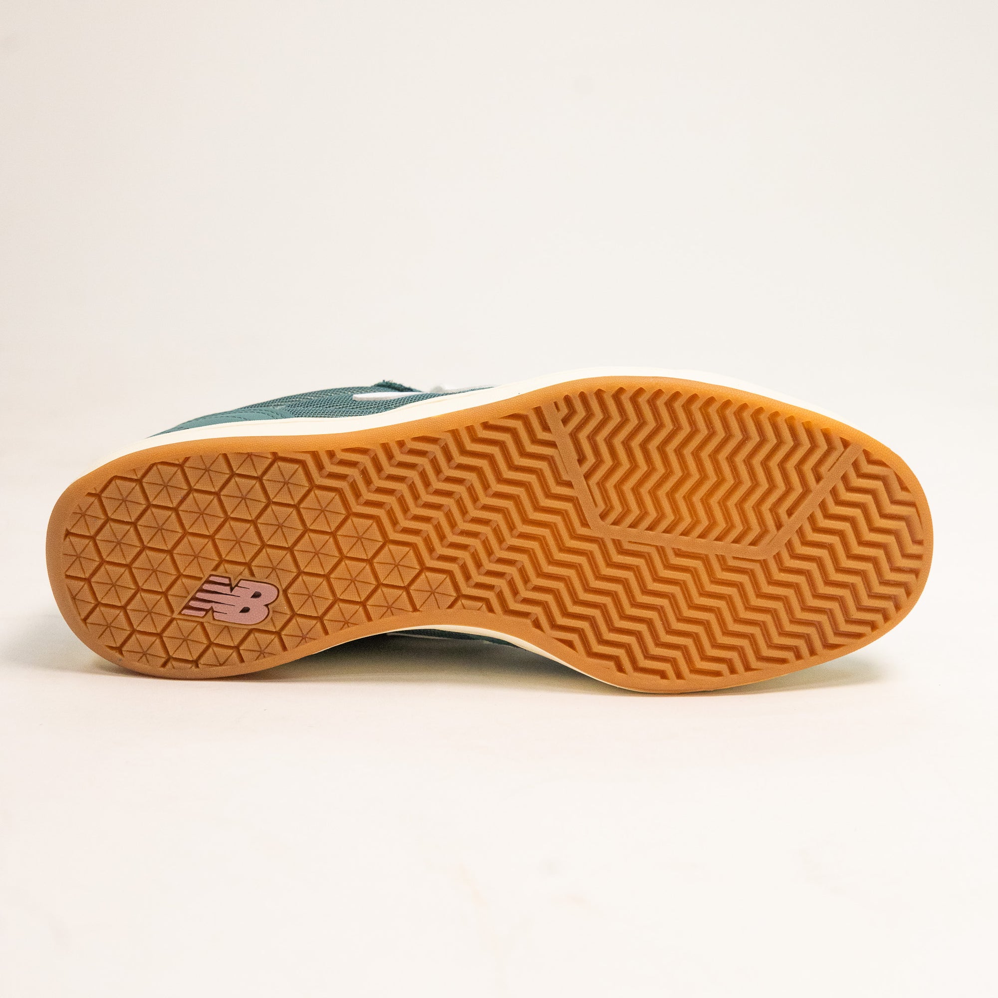 green men's new balance shoe with white sole