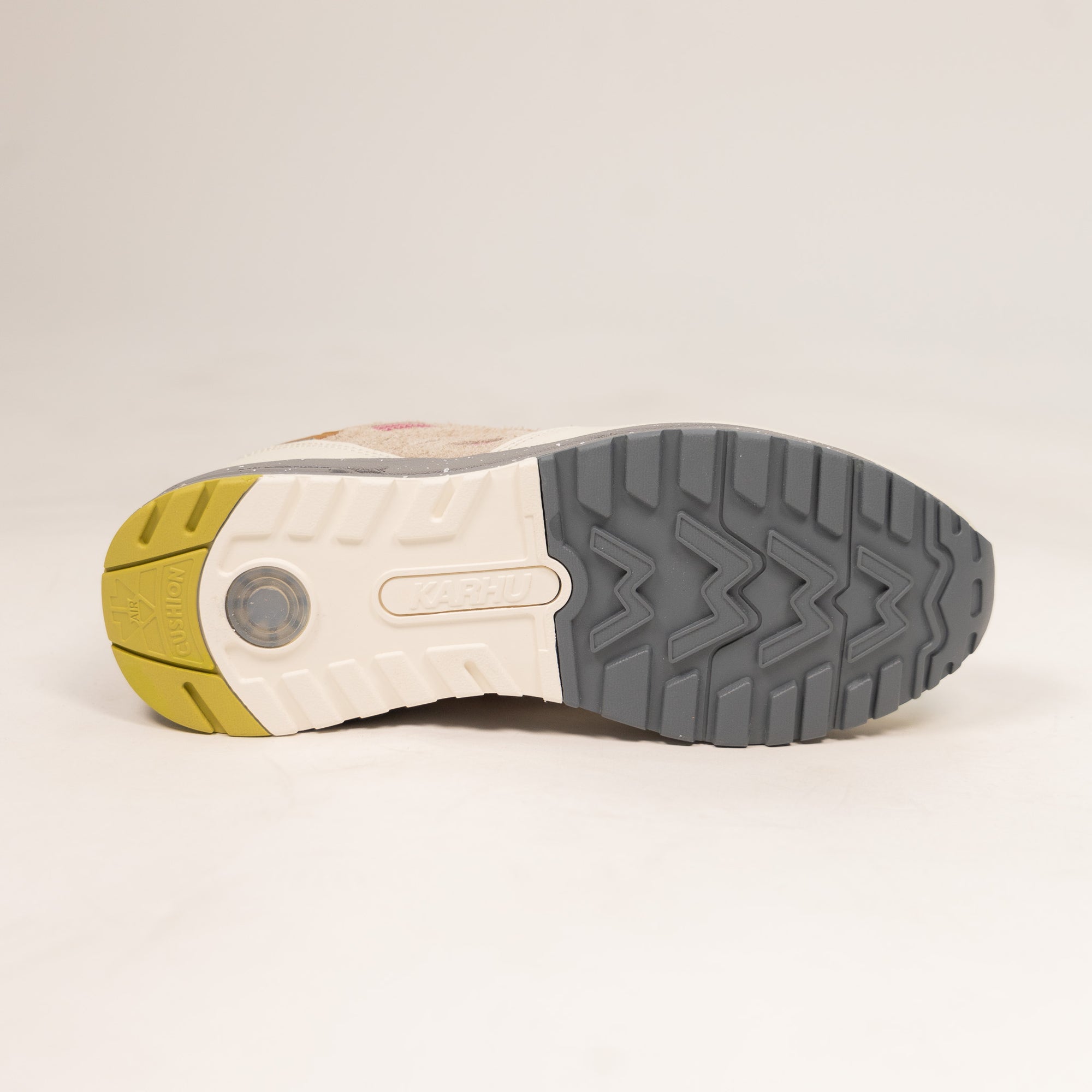 tan karhu women's shoe with grey speckled sole and pink and yellow details