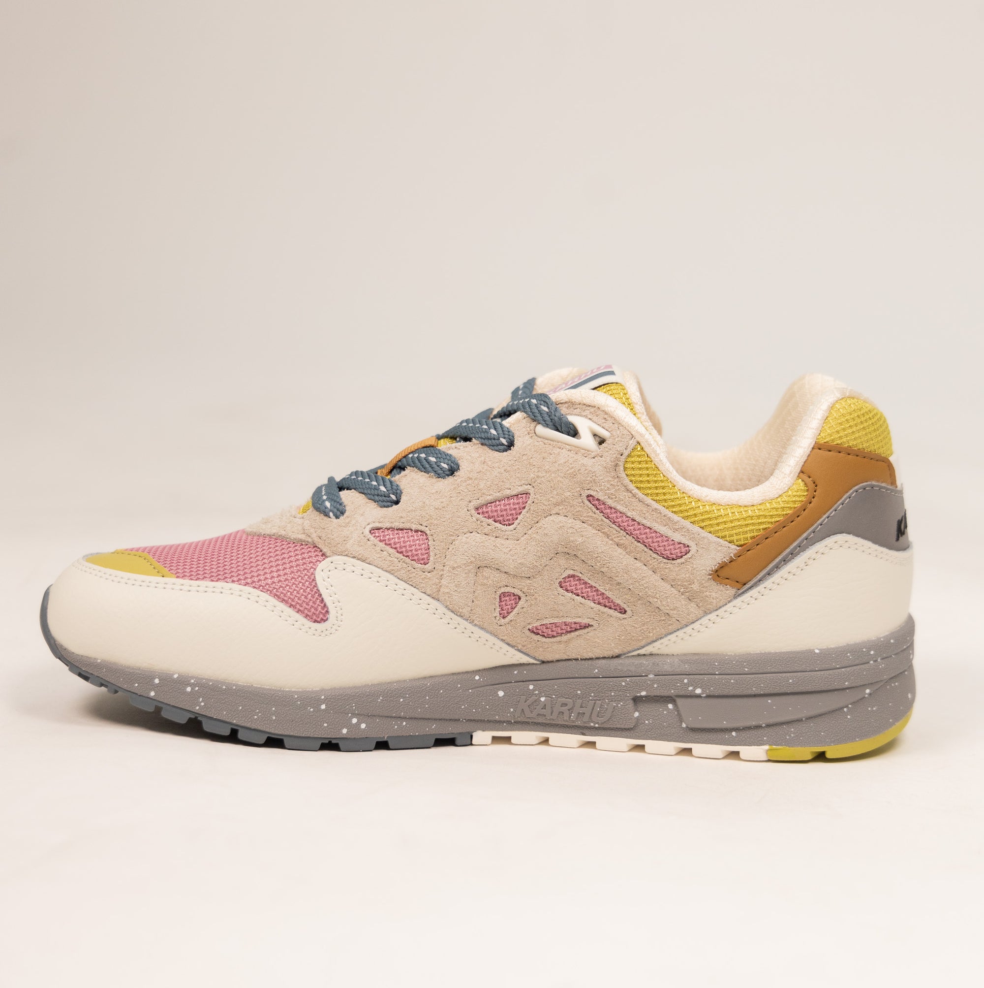 tan karhu women's shoe with grey speckled sole and pink and yellow details
