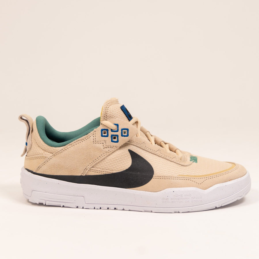 tan nike sb kids day one skate shoe with gum sole black swoosh and green detail