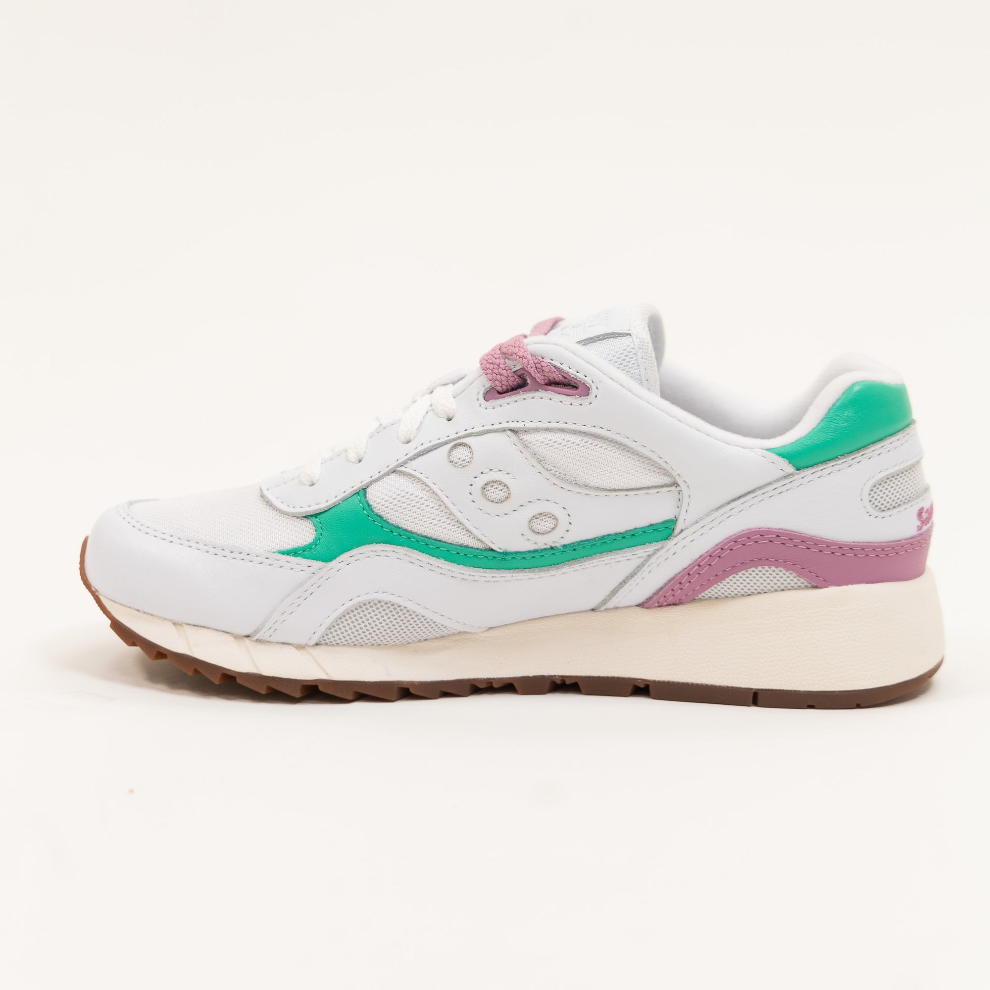 white leather saucony shadow 6000 women's comfort shoe with an off white sole and green and purple detail