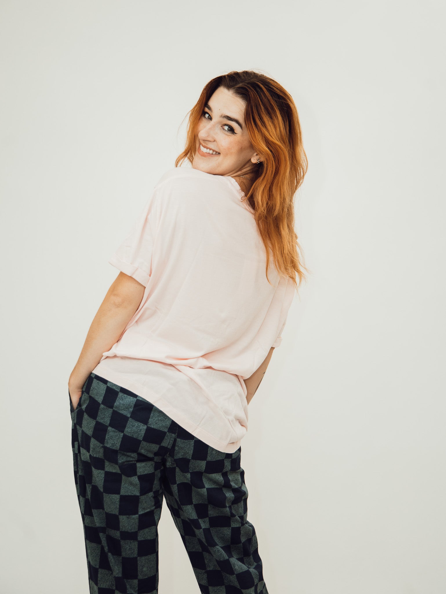 pink oversized women's tee shirt from the laundry room featuring the slogan ain't my first rodeo