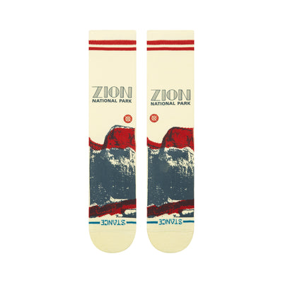 Pair of stance crew socks with red and blue zion national park design on a white background