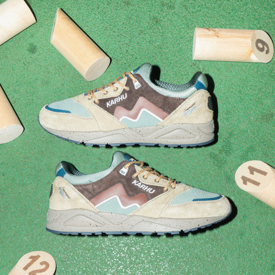 brown and green karhu men's and women's comfort shoe