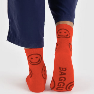 red baggu crew sock featuring smiley faces