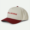 brixton hat with a red bill, off white top and the phrase save a horse on the front in red