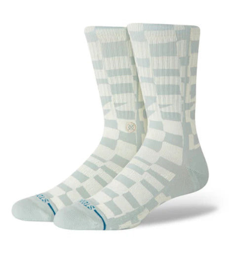 Pair of light blue and white patterned socks on a white background