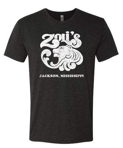 A dark heather gray short-sleeve t-shirt with a distressed white graphic on the front featuring a lion head and the text 'Zoli's Jackson, Mississippi'.