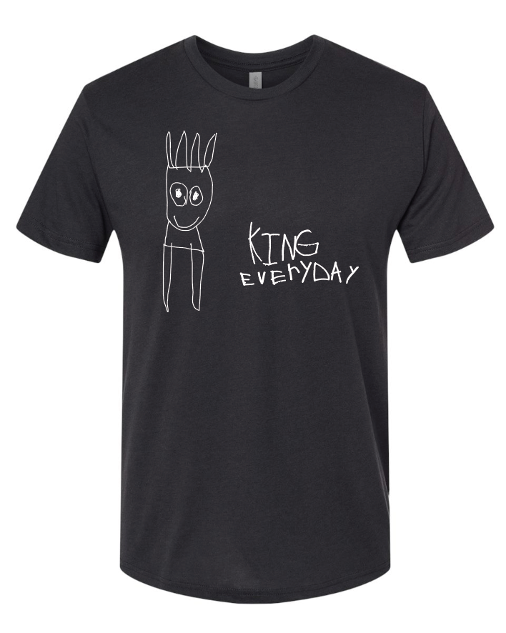 A black short-sleeve crewneck t-shirt featuring a white hand-drawn style graphic of a cartoon character with a crown and the text 'KING EVERYDAY' printed on the front.
