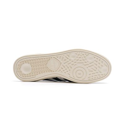 white leather adidas men's busentiz skateboard shoes with black stripes and off white sole