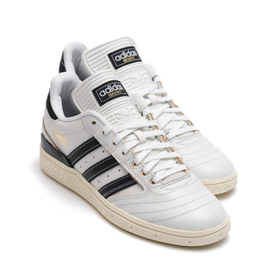 white leather adidas men's busentiz skateboard shoes with black stripes and off white sole