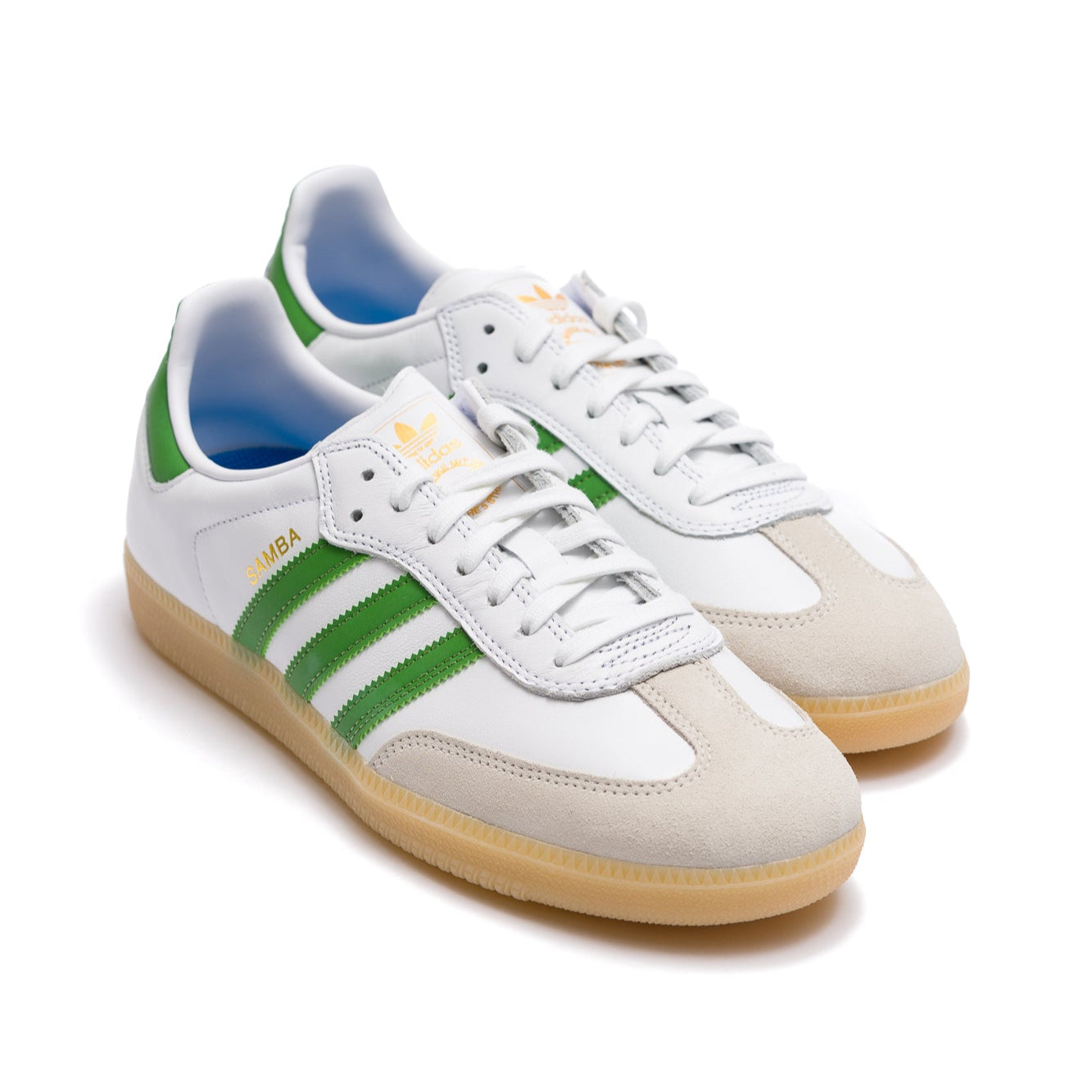 white leather adidas samba adv with grey suede to, gum sole and green stripes