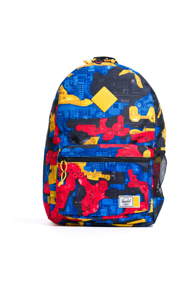 multi-colored herschel x lego heritage youth backpack featuring lego bricks