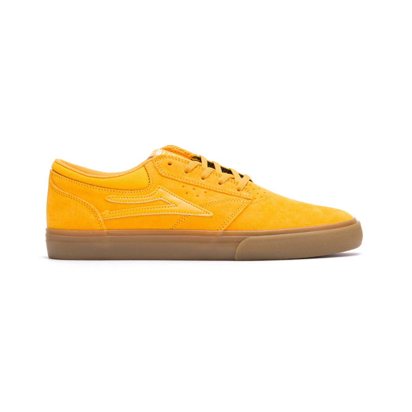 Yellow lakai griffin sneaker with a brown sole on a white background