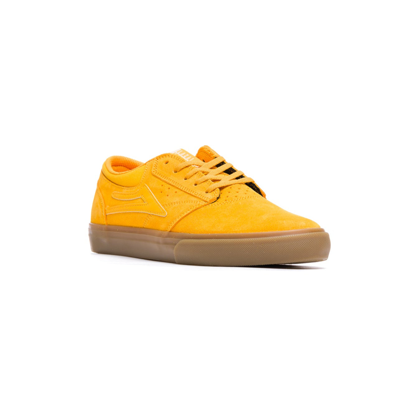 Yellow lakai griffin sneaker with a brown sole on a white background