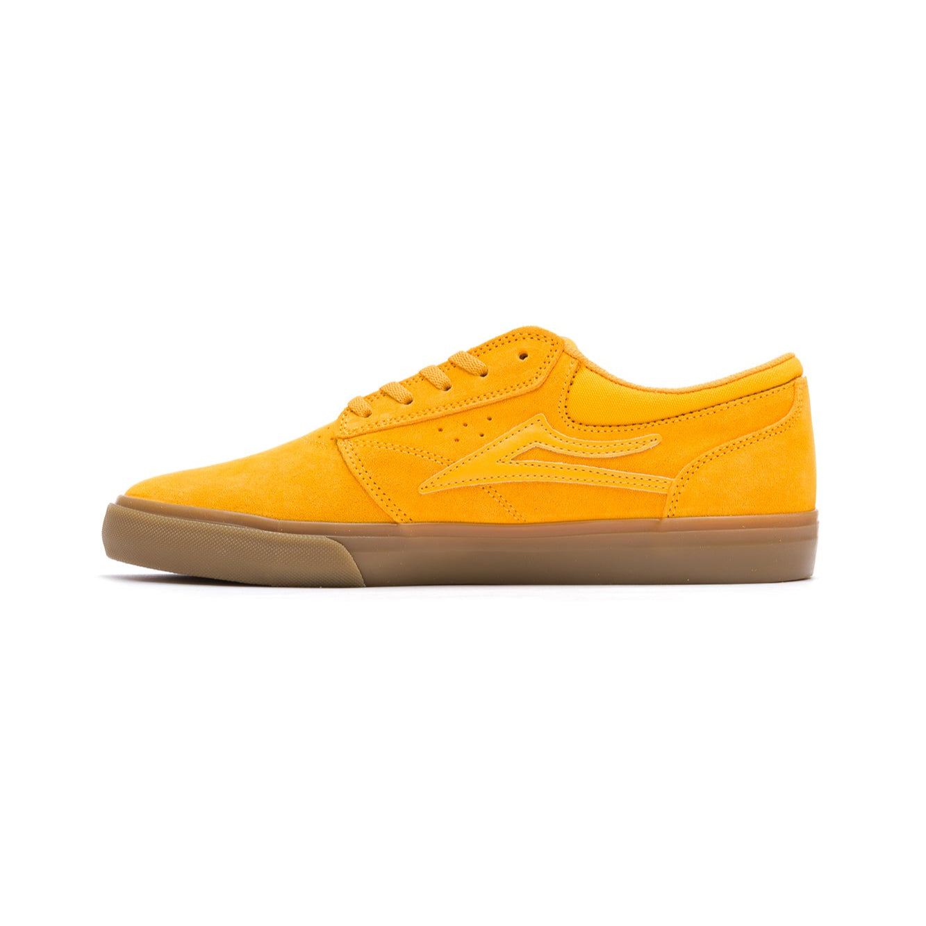 Yellow lakai griffin sneaker with a brown sole on a white background