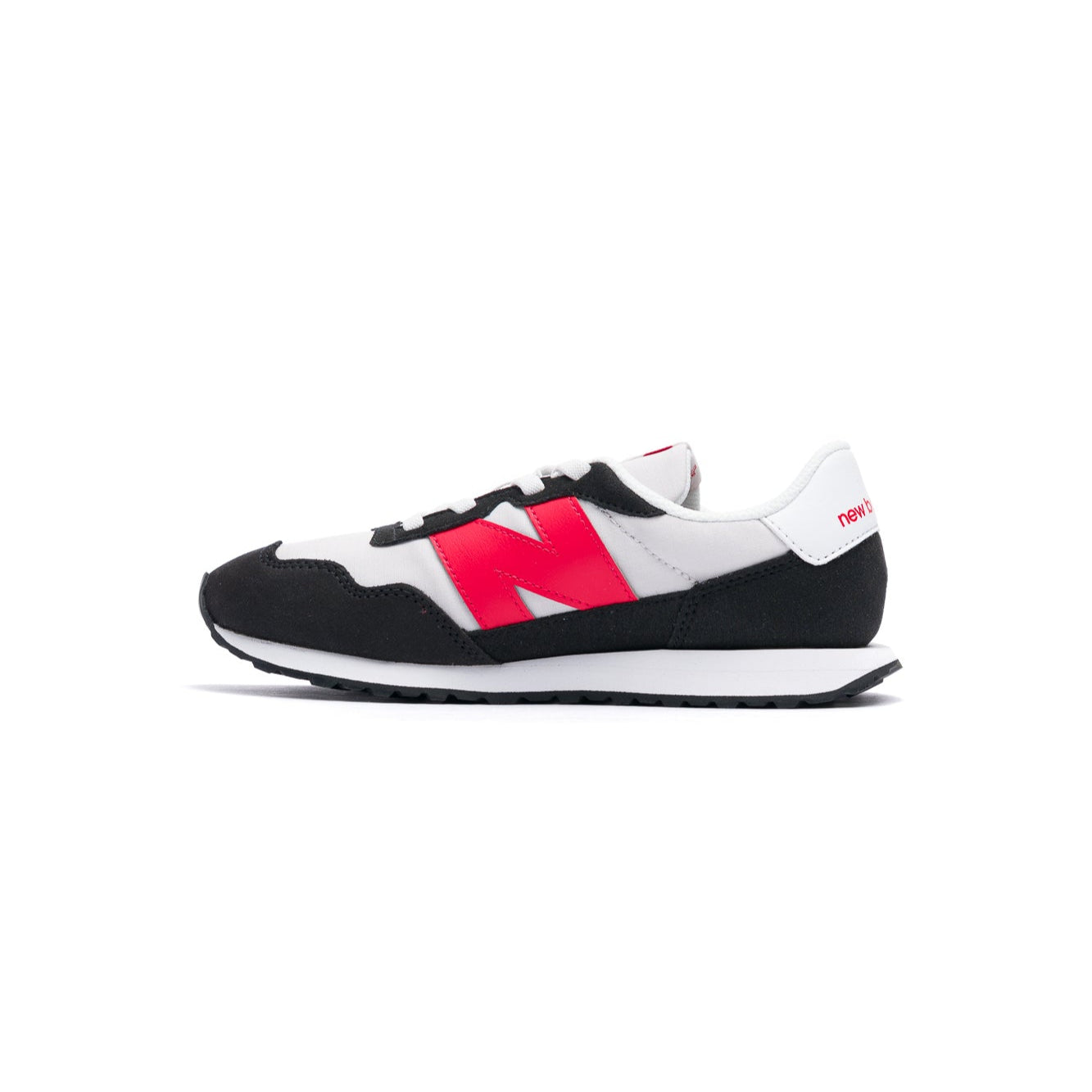 Black and white new balance 237 kids and toddler sneaker with red accents on a white background