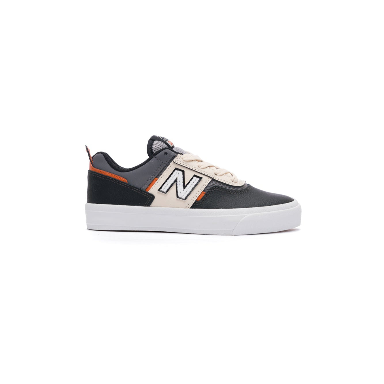 Black and white new balance numeric kids skateboarding sneaker with orange accents on a white background