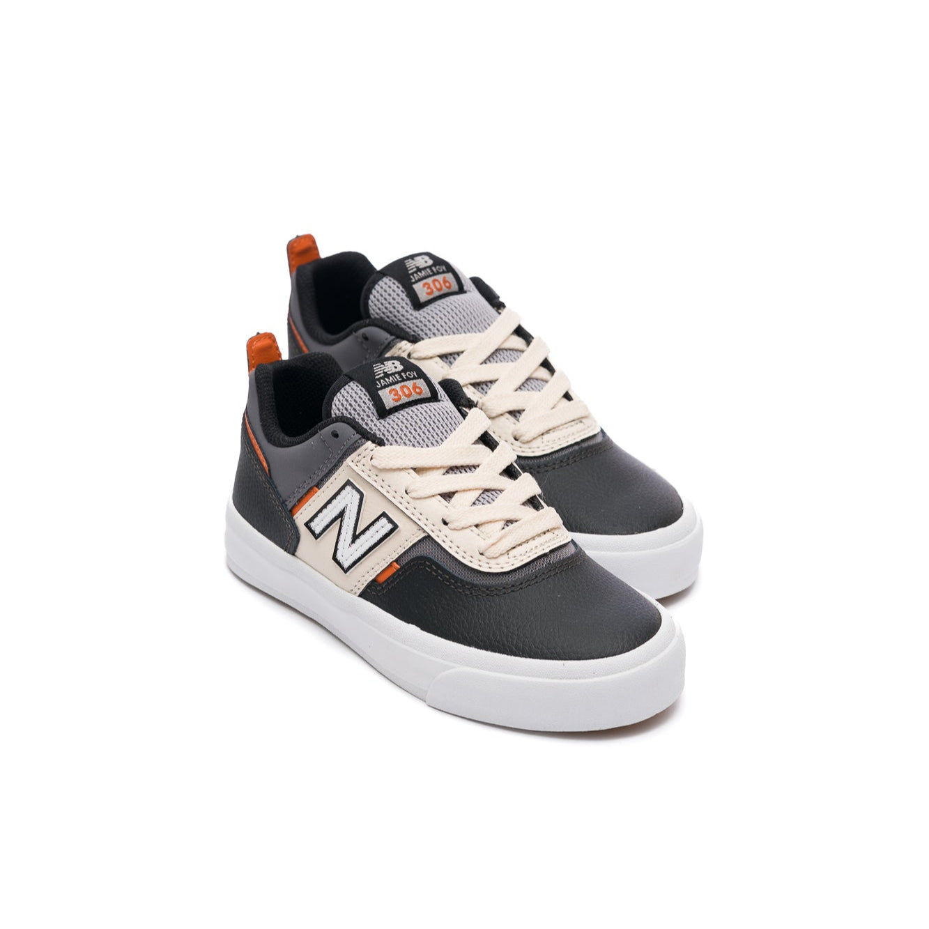 Black and white new balance numeric kids skateboarding sneaker with orange accents on a white background