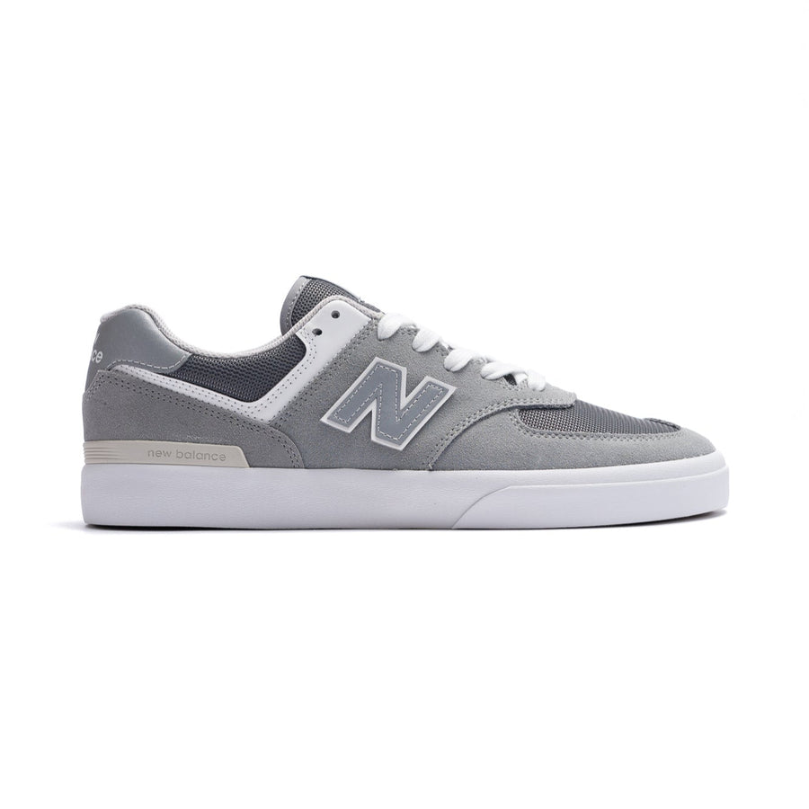 grey new balance numeric men's 574 skateboard shoe with white sole available in wide size 2e