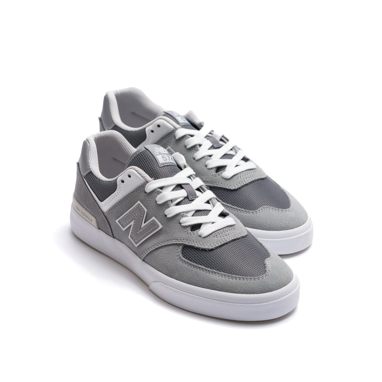 grey new balance numeric men's 574 skateboard shoe with white sole available in wide size 2e