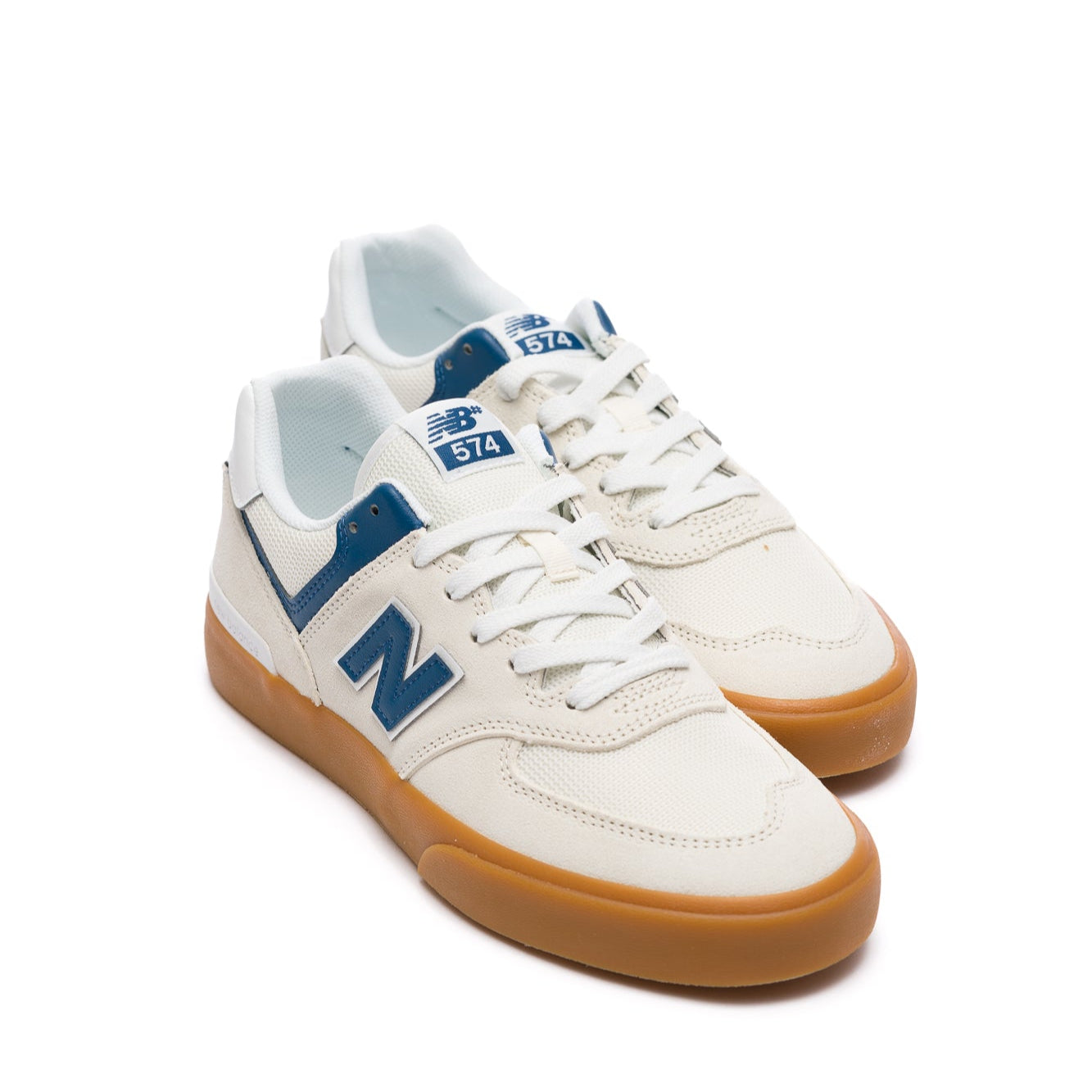 White new balance numeric 574 skateboard sneaker with blue accents on a white background and gum sole