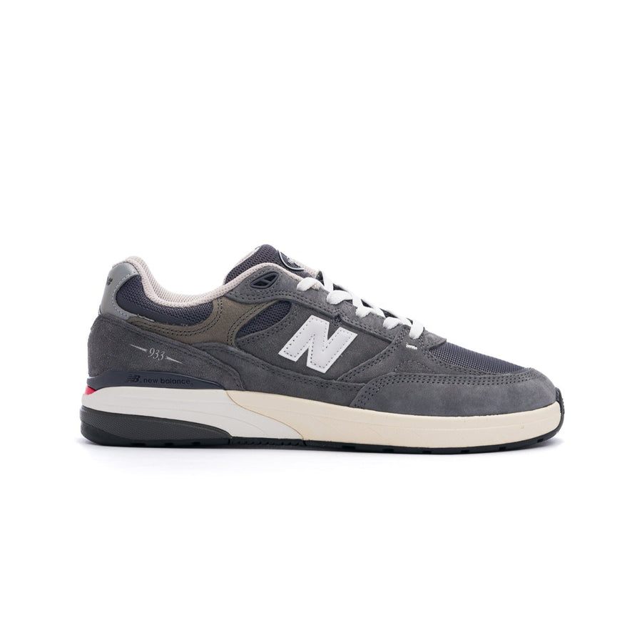 grey new balance numeric 933 andrew reynolds men's skateboard shoe with white and off white sole with silver N