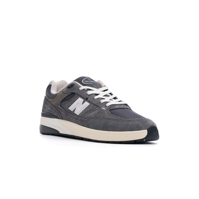 grey new balance numeric 933 andrew reynolds men's skateboard shoe with white and off white sole with silver N