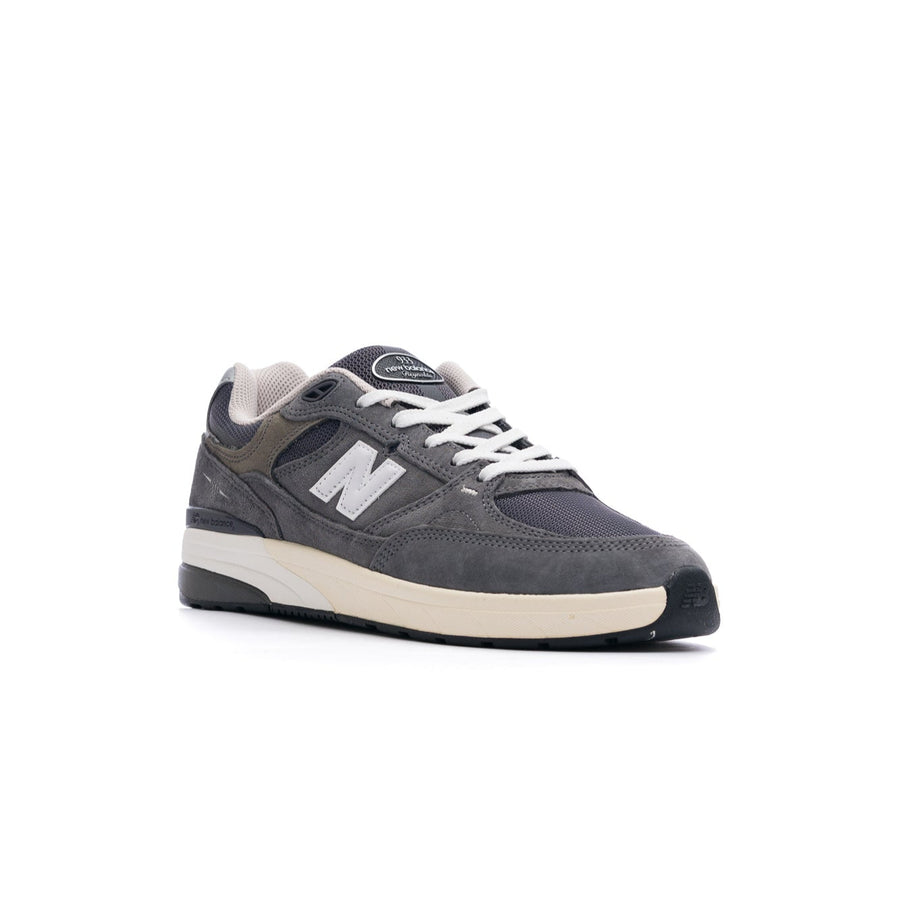 grey new balance numeric 933 andrew reynolds men's skateboard shoe with white and off white sole with silver N