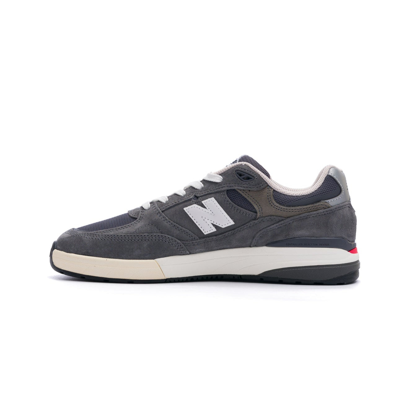 grey new balance numeric 933 andrew reynolds men's skateboard shoe with white and off white sole with silver N