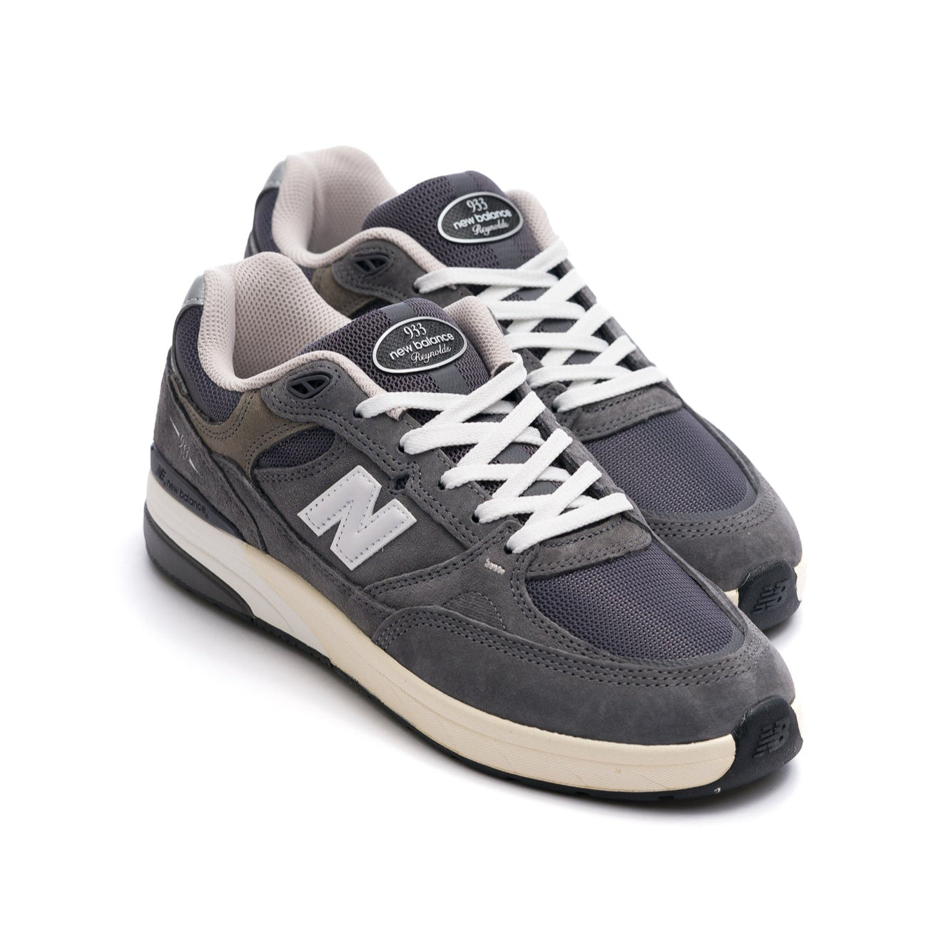 grey new balance numeric 933 andrew reynolds men's skateboard shoe with white and off white sole with silver N