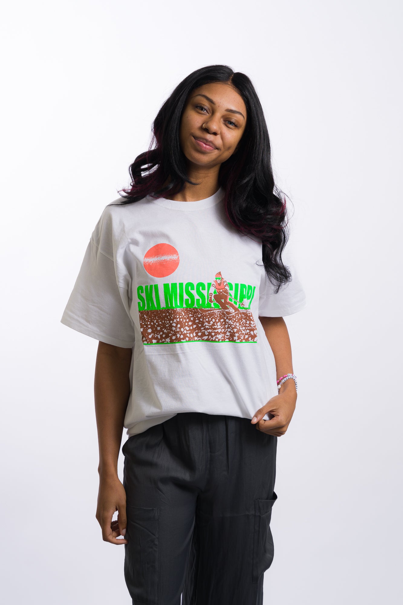 white short sleeve tee shirt with lime green ski mississippi on the front